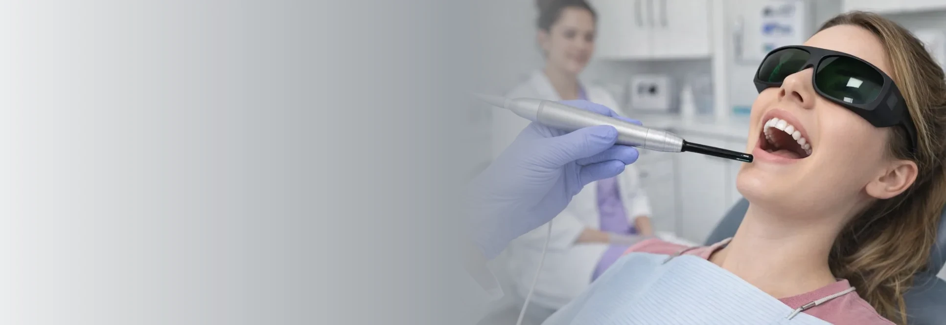 Dental laser on female in dental chair — Laser Dentistry at PermaSmile! in Ottawa