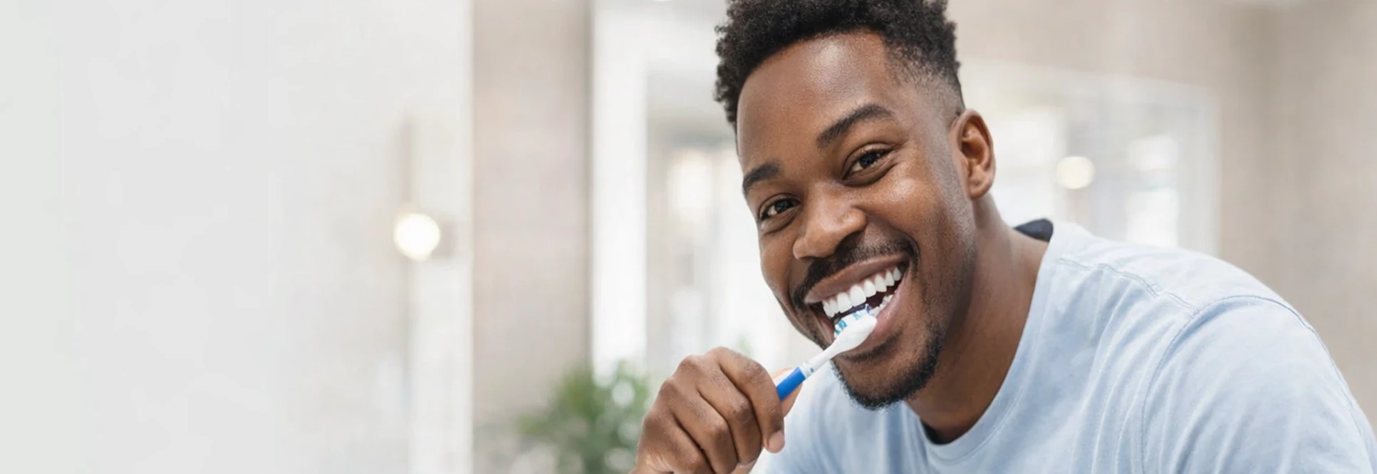 Man holding toothbrush — Dental Hygiene at PermaSmile! in Ottawa