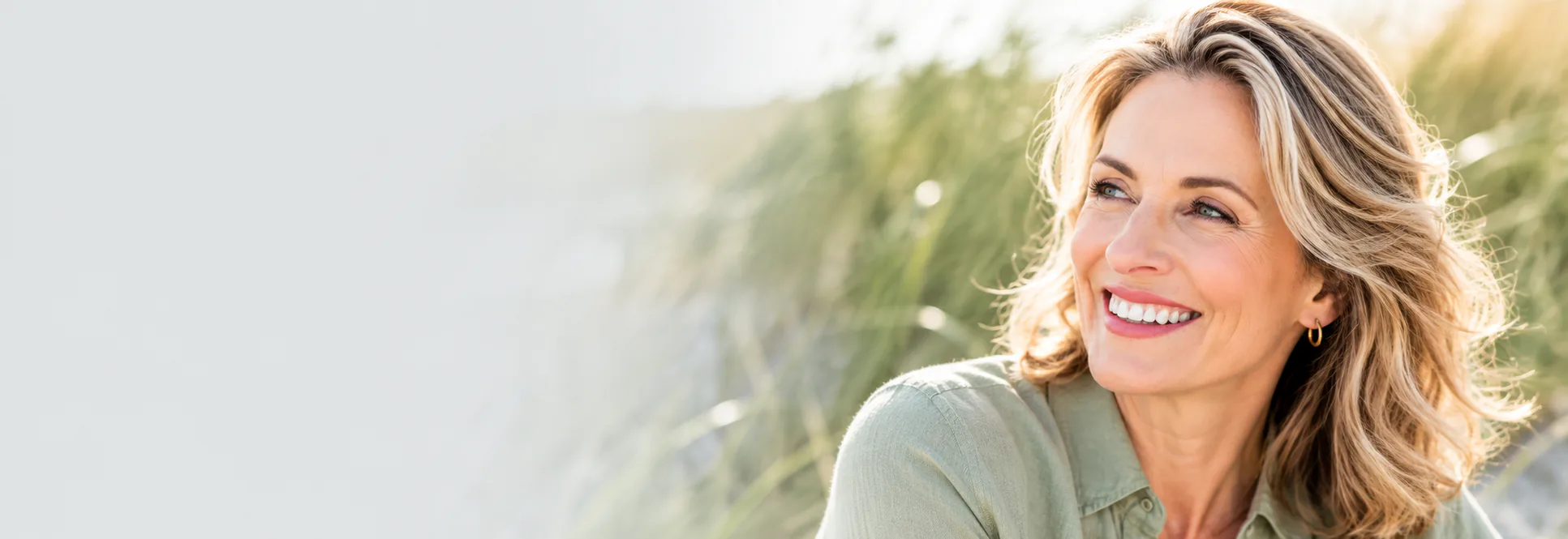 Woman outside smiling — Porcelain Crowns at PermaSmile! in Ottawa