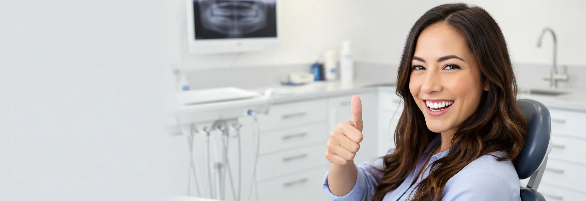 Young woman smiling in dental chair — Preventative Dentistry at PermaSmile! in Ottawa